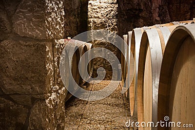 Closeup of Wine Barrels in a Wine Cellar