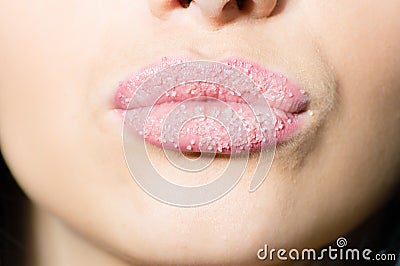 Closeup on woman sweet candy sugar lips kiss