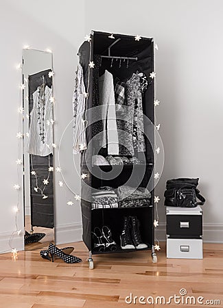 Clothes organizer and mirror decorated with lights