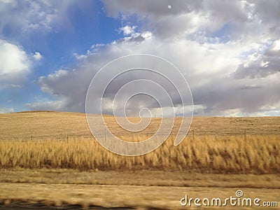 Clouds rolling over the wheat.