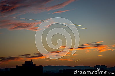 Cloudy Sunset Sky With Airplanes And Skyline