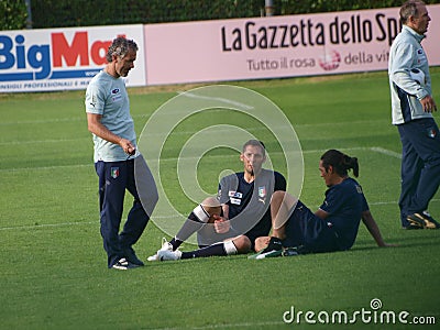 The coach of the Italia soccer team and two player