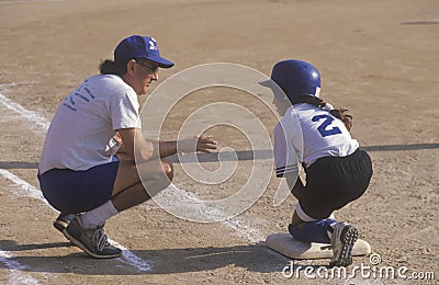 Coach with player on base,