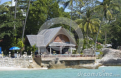 Coast line bar with a tropical background