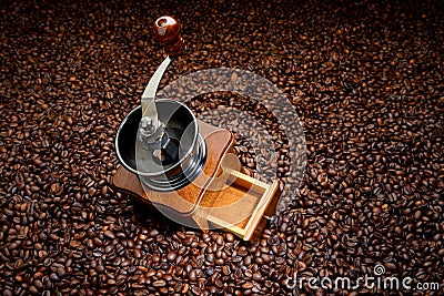 Coffee beans and old hand grinder