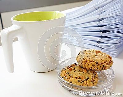 Coffee cup with cookie for break