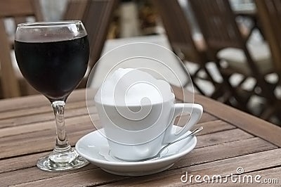 Coffee cup and red wine glass outdoor
