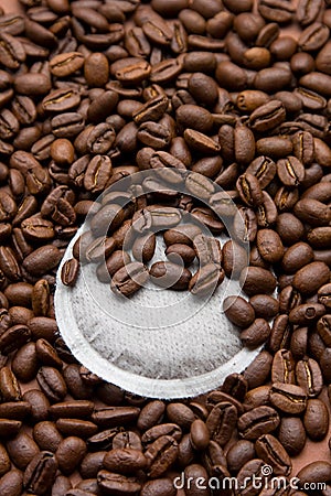 A coffee pad with many coffee beans