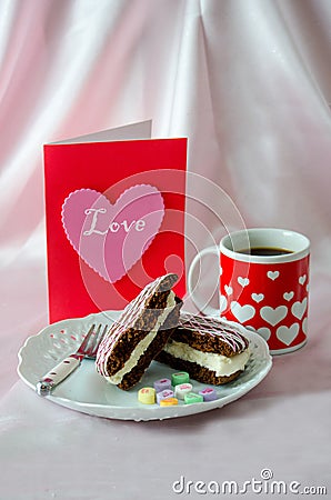 Coffee and sweets with a pink love heart card