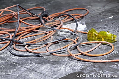 Coils of electrical cable lying on floor workplace