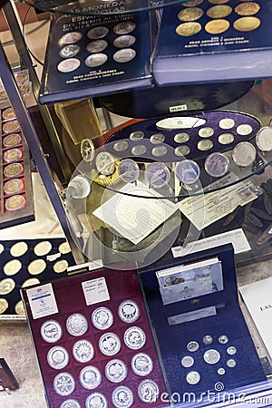 Coins on counter at numismatics store