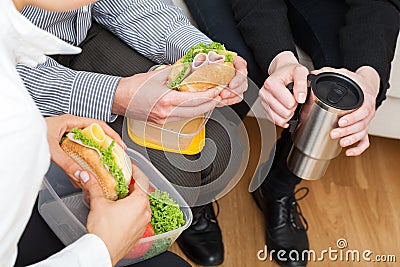 Colleagues eating healthy lunch