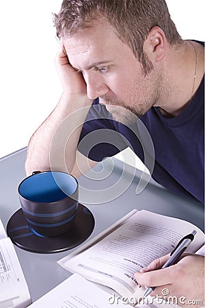 College Student with Books on the Table Studying