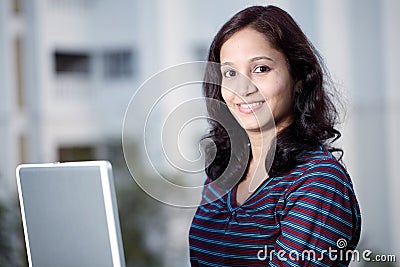 College student working on her laptop