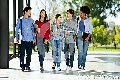 College Students Walking Together On Campus