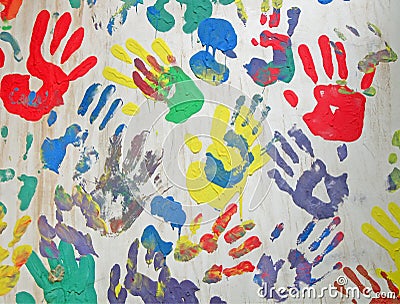 Color handprint diversity on concrete white wall