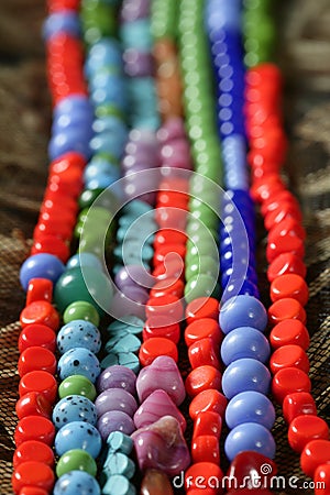 Color stones jewelry necklaces, straw background