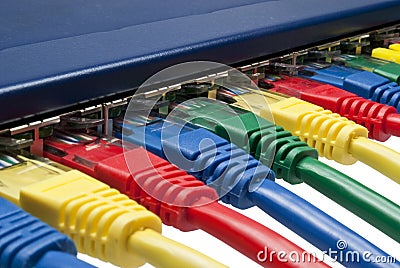 Colored network plugs connected to router / switch