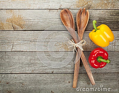 Colorful bell peppers and kitchen utensils