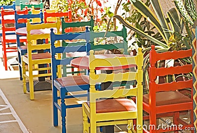 Colorful chairs outside a restaurant.