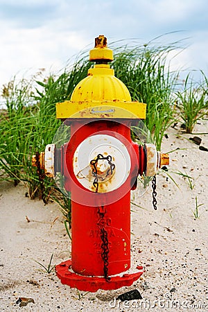 Colorful fire hydrant on the beach