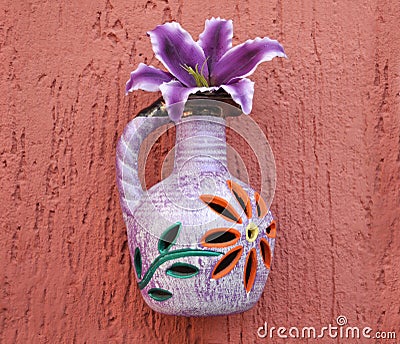 Colorful Flower vase on a red wall