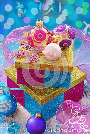 Colorful gift boxes with christmas baubles