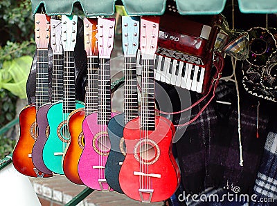 Colorful guitars in musical instruments shop