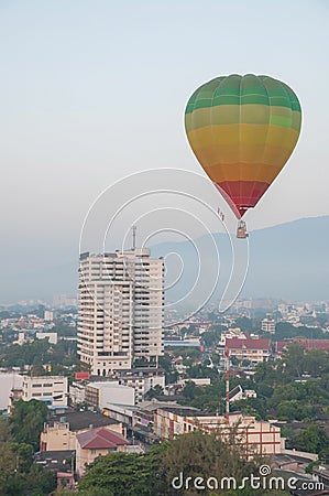 Colorful Hot Air Balloon in Flight Above the City