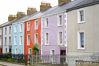 Colorful houses with a to let sign