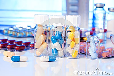 Colorful medical capsules in bottle