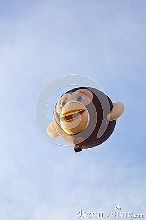 Colorful monkey balloon taking off