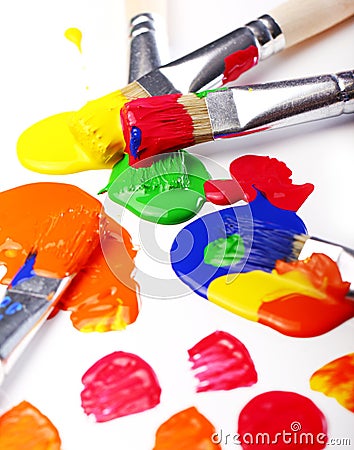 Colorful paint and brushes