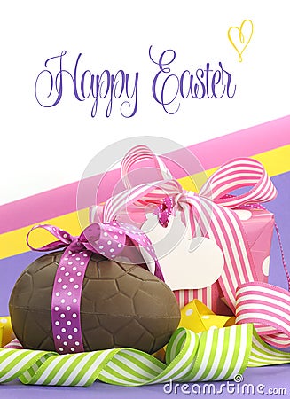 Colorful pink, yellow and purple theme Happy Easter theme with chocolate egg and gift box with sample text