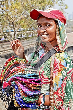 Colorful purse vendor with baseball hat