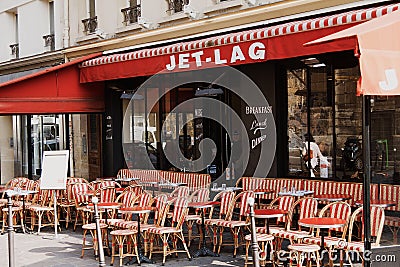 Colorful tables and chairs in sidewalk cafe Paris, France