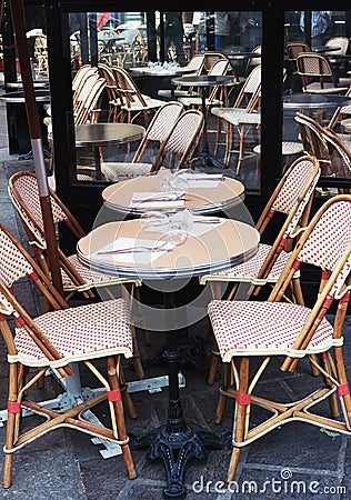 Colorful tables and chairs in sidewalk cafe Paris, France