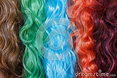 Coloured wigs with long wavy fake hair