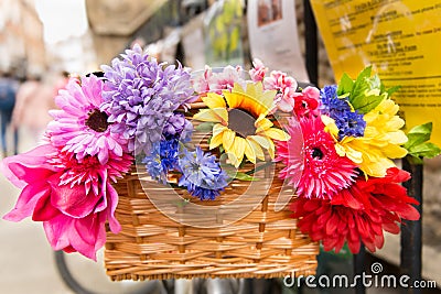 Colourful flowers in bike basket