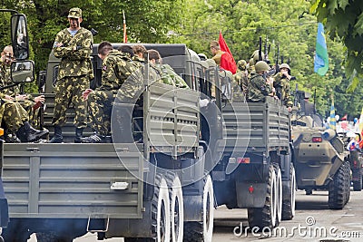 Column of military equipment on parade in honor of the 69th anni