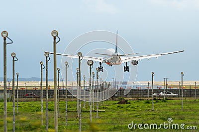 Commercial jet airliner landing at airport