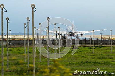 Commercial jet airliner landing at airport