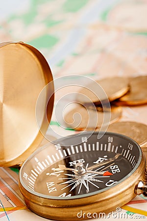 Compass and golden coins