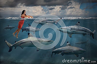 Competitive Business Concept With Businesswoman and Sharks