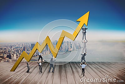 Composite image of business team holding up arrow