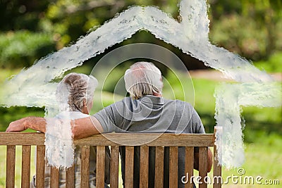 Composite image of couple sitting on the bench with their back to the camera