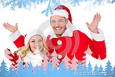 Composite image of festive couple smiling with arms raised