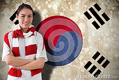 Composite image of football fan in white wearing scarf