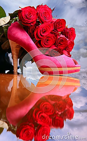 Composition with red roses and pink female shoe