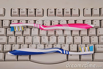 Computer keyboard and toothbrushes.